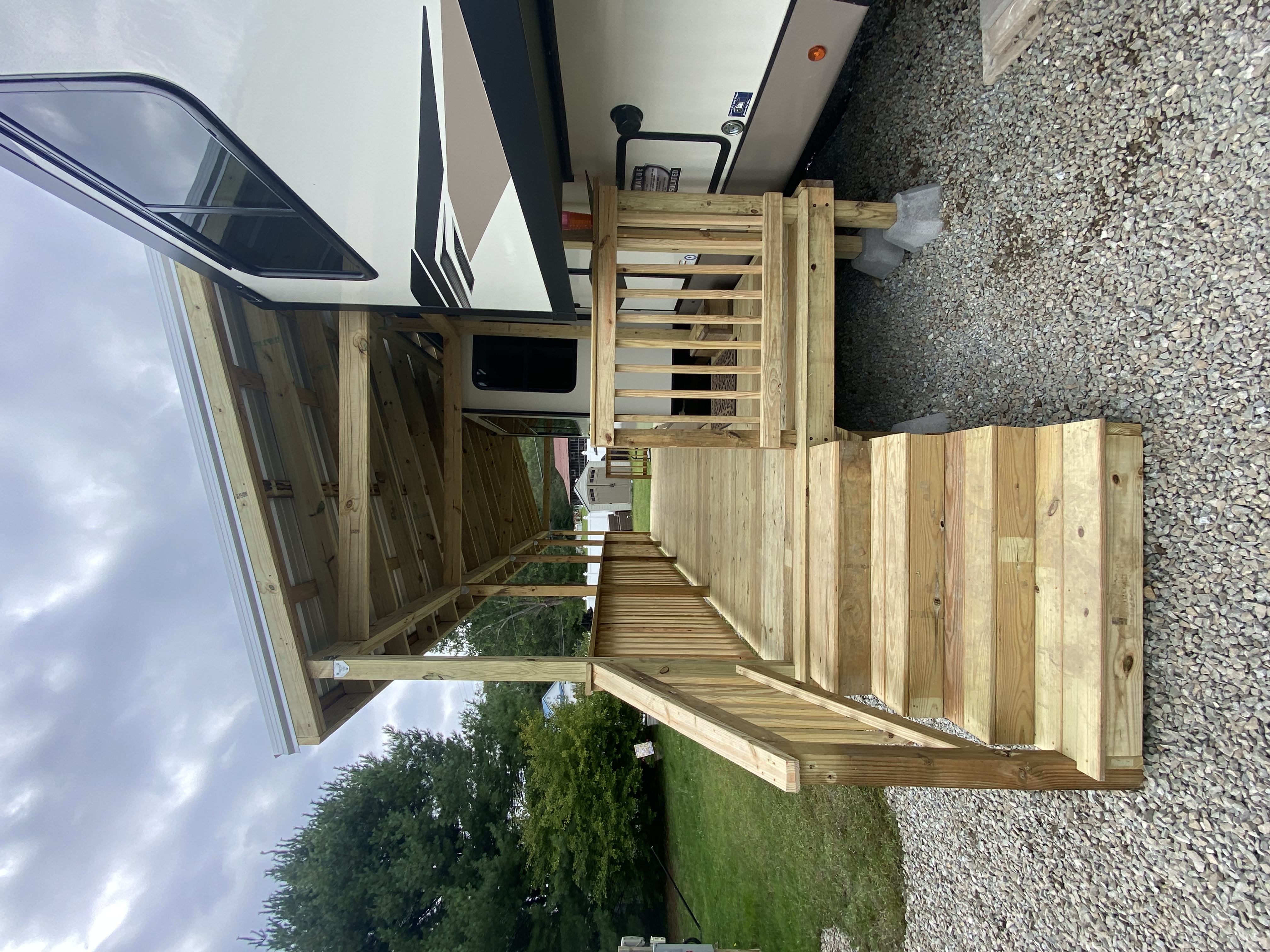 Covered custom wood deck with metal roof cover