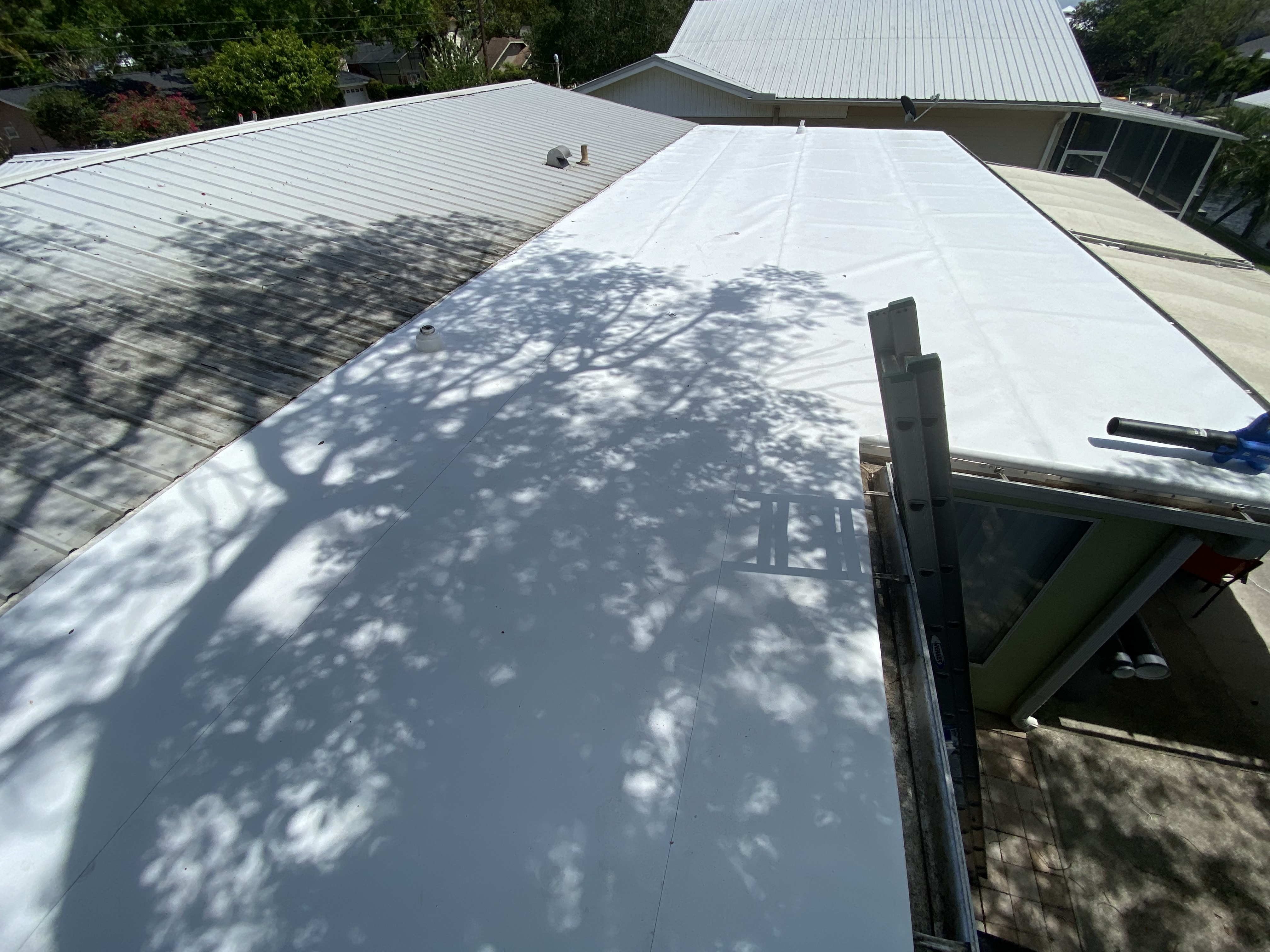 TPO roofing installation with insulated recovery deck