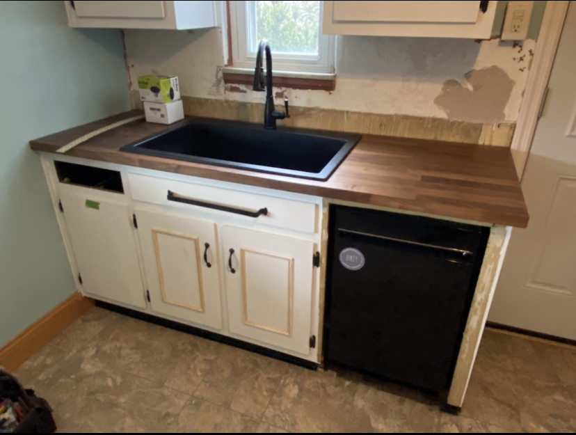 New wood butcher block countertops with kitchen sink install 