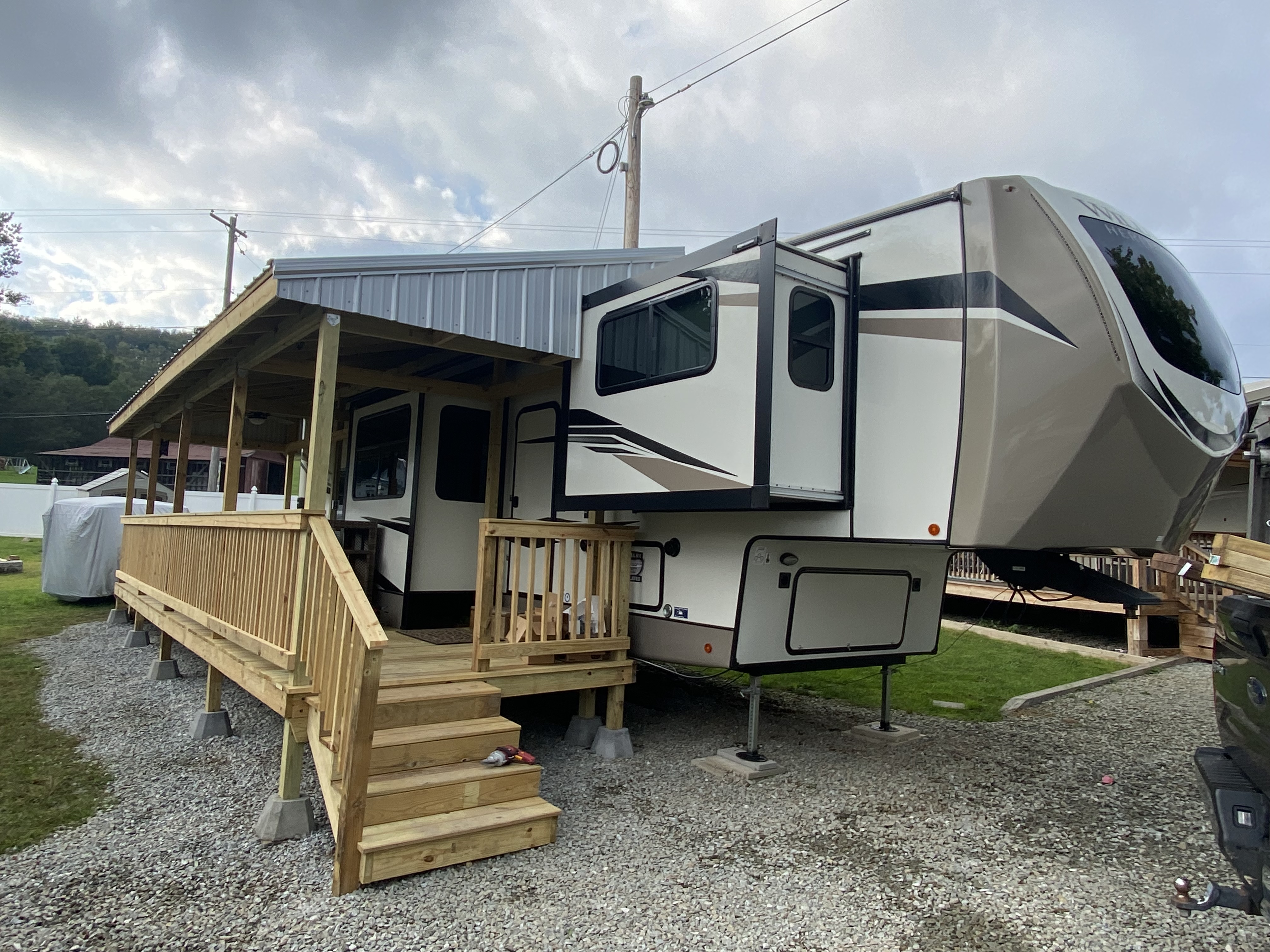 Covered custom wood deck with metal roof cover