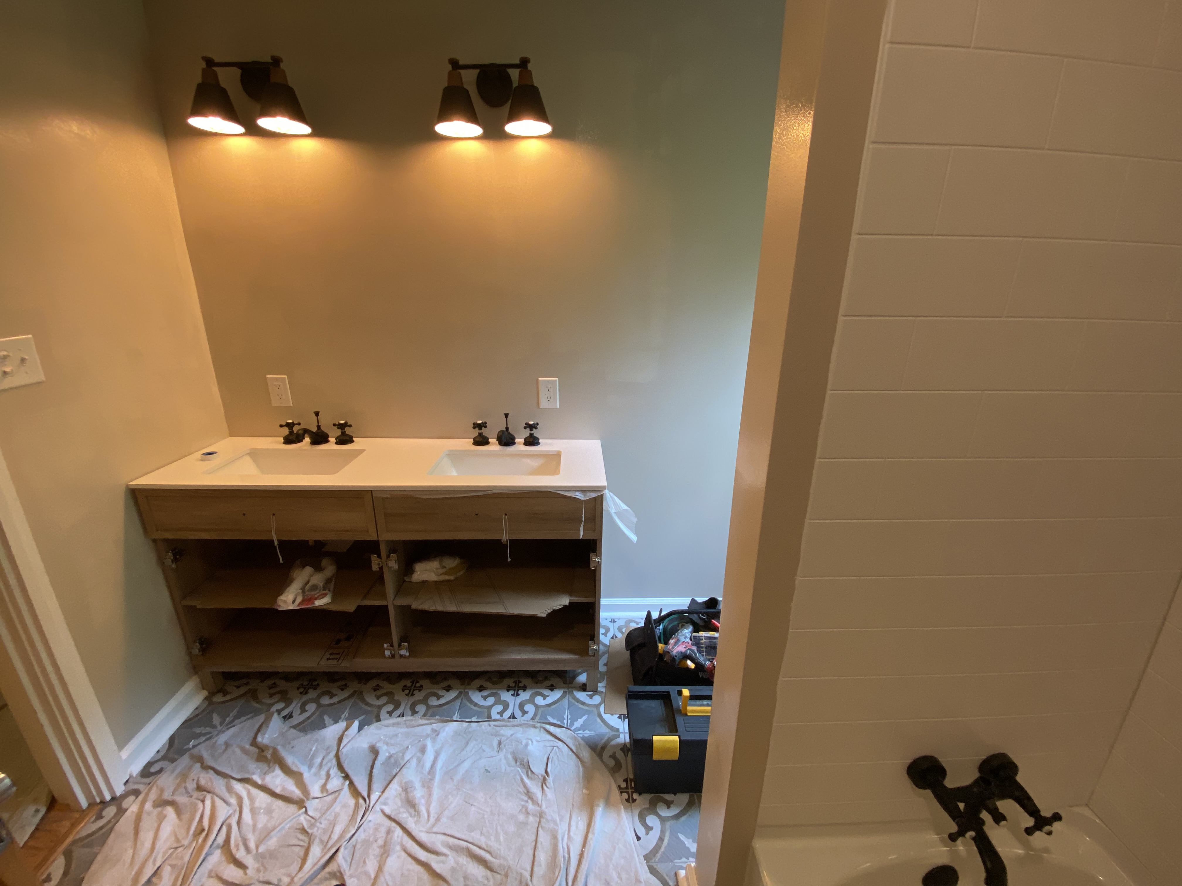 Bathroom remodel with double vanity and tile floor